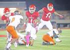 Groesbeck ball carrier Tyrique Carter (1) stares down a Panther defender during this run play last Friday night in the Goats 50-0 homecoming win over Palestine Westwood. Photo by Angela Crane/Special to The Groesbeck Journal
