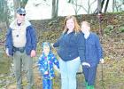 Despite rainy conditions, State Park Police Officer Kyle Ware, Groesbeck residents Kasen Robinett, Raven Robinett and Natalie Burroughs enjoy the Kid Fish event at Lake Springfield during the Fort Parker State Park Kid Fish on Jan. 28. 
