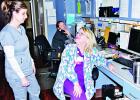 Parkview Regional Hospital’s Emergency Room Director Teri LaFoy, left, confers with registered nurses Becky Flori, of Teague, at front, and Casey Ebbett, of Mexia, at rear, who are charting patient progress. LaFoy and other hospital personnel try to educate people on early heart attack care, which is vital to avoid negative residual effects of such incidents. Photo by Roxanne Thompson/The Mexia News