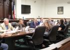 Limestone County Commissioners read along as Judge Richard Duncan reads a proclamation highlighting the importance of child abuse awareness and prevention at the meeting on Tuesday, April 9. Article Image Alt Text