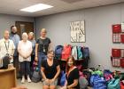 H.O. Whitehurst Student Support Specialist David Robertson, First Methodist Church Pastor Ben Huebner, FMC Administrator Judy Ross, FMC Pastoral Counselor Alisa Phillips, HOW Principal Kristen Curry FMC member Carol Bielamowicz, and HOW Assistant Principal Kelley Copeland pose with all 107 loaded backpacks donated by the combined efforts of FMC Groesbeck and Thornton Methodist Church. Photo by Racheal Clark Article Image Alt Text