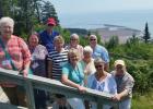 Front row: Linda Dagle, Carol Chappell, Kay Schmaltz, Bill Schmaltz; Middle row: Mary Belle Leach, Judy Wardle, Jerri McBay; Back row: Joe Leach, Mary Jane Jones, Mike Chappell. Along the Fundy Trail overlooking the Bay of Fundy. Article Image Alt Text