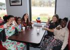 Fourth and sixth graders enjoy some customized hot cocoa and other treats after getting a picture with Santa at the Red Goat Cafe Friday, Dec. 13. Photo by Racheal Clark/Groesbeck Journal Article Image Alt Text