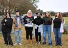 Groesbeck High School volunteers with the help of a few younger volunteers placed wreaths on all of the veterans graves at La Salle Cemetery Saturday morning. (l to r) Autumn Little, Lyric Hargrove, Volunteer Coordinator Stephanie Eubanks, N'Kyra Hargraves, Dallie Bagley and Madison Binion. Article Image Alt Text