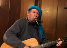 Mr. Blair, park host from Missouri, entertained the hikers with songs as they warmed up after the hike Article Image Alt Text