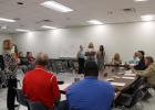 GEAR UP Sponsor Mrs. Tami Kadlacek (left) and three juniors (left to right: Reagan Black, Rainey Samuels, Soraya Smith) who are part of the program listed several activities and benefits provided through GEAR UP to the GISD Board at the meeting on Monday, April 17.
