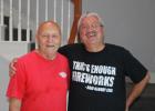 Retired firework pyrotechnician Jay Smith poses with the new pyrotechnician Marvin Beechley on a break from testing sound equipment for Thursday’s show. Photo by Racheal Clark Article Image Alt Text