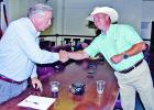Opponents in the May 22 Republican runoff for Limestone County Judge: Richard Duncan, left, and Mark Roark shake hands immediately after the results were announced that Duncan was the winner. The two and their supporters spent the evening in the county courtroom and judge’s chambers of the courthouse.  Photo by Roxanne Thompson/Groesbeck Journal