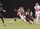 Wide receiver Nick Sanchez jukes a Centerville Tiger defender, during Groesbeck’s win last Friday night in Centerville. Sanchez had five catches for 140 yards and scored two touchdowns as the Goats beat the Tigers, 42-19. Photo by Rebecca Jones Article Image Alt Text