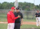 Groesbeck baseball coach Greg Hazelwood, left, makes a point to an umpire during a game against Mexia at Goat Field on Tuesday night. Groesbeck took a 3-1 victory and raised its District 20-3A record to 9-3. Photo by Skip Leon/The Groesbeck Journal