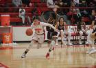 Groesbeck’s Alyssa “Marie” Gonzalez (5) drives around Fairfield’s Kristavia Nelms (3) during a game at the Groesbeck High School gym Tuesday. Gonzalez scored a team-high eight points in an 83-16 loss.  Photo by Skip Leon/The Groesbeck Journal