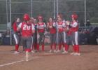 The Lady Goats are all smiles as they celebrate Kamryn Curry's (20) home run in the third inning against Fairfield to tie the game. Curry hit two home runs and drove in seven runs to help the Lady Goats to a 17-7 victory. Photo by Mitchell Pate/Groesbeck Journal Article Image Alt Text