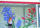 Mural artist Tyler Kay enjoys interacting with people and creating public art, so this large mural in downtown Groesbeck provides the perfect opportunity. Flowers often find their way into Kay’s work.... Photos by Alexandra Cannon, Groesbeck Journal