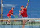 Josie Wells, left, teams with Hannah DeFriend as the duo went on to defeat Robinson’s Brown and Van Zee in two sets during their girl’s doubles match last Thursday. Photo courtesy of Kirk Hazlip