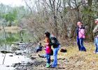 Jessica Ferguson, of Groesbeck, center, helps her daughter Aubrey, 7, cast her line into the water of Springfield Lake while husband Chris watches at right. Also shown are David and Shannon Hicks, and their sons, David, 6, and Tyler, 4. Their activities were part of the Youth Trout Clinic, held Saturday-Sunday, Jan. 27-28. Photos by Roxanne Thompson/The Groesbeck Journal Article Image Alt Text